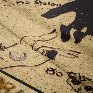 Close-up of vintage celestial tapestry fabric showing moon print and So Below text