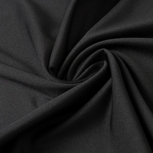 Macro detail of high-elastic black knit fabric texture showing premium weave and drape