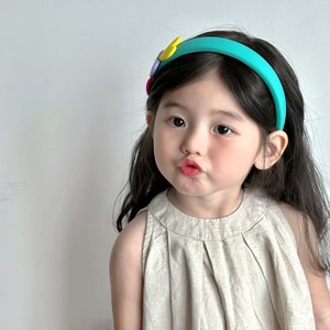 Cute contrast heart sponge headband for kids shown on a model with a beige linen dress
