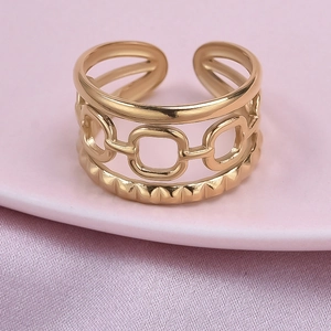 Macro shot of gold-plated 304 stainless steel multi-layer hollow open ring on silk