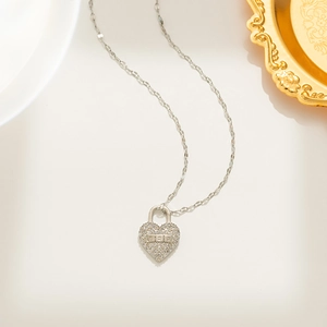 Silver heart lock necklace with pavé cubic zirconia on minimalist stainless steel chain
