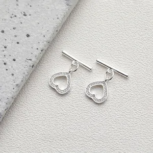 Detailed macro view of 14K silver plated OT toggle heart clasp with pave zircon stones