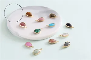 Variety of natural gemstone teardrop pendants with metal loops for DIY jewelry making