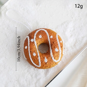 Detailed view of a brown donut Christmas ornament with size 10cm and weight 12g markings