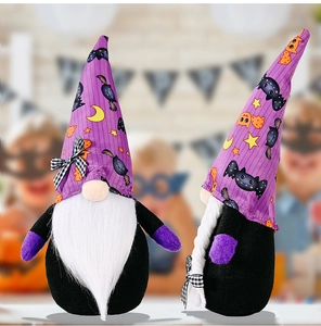 Detail view of purple Halloween gnomes with bat patterns and white beards for home decor