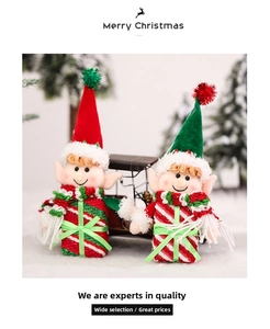 Detail of cute Christmas elf hanging ornaments with striped scarves and pointed hats