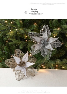 Detail of silver and champagne mesh Christmas flowers with glitter on festive tree