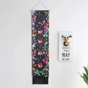 Vertical floral moon phase tapestry with black base and elegant tassels for wall decoration