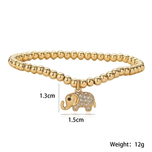 Detail of 18K gold-plated beaded bracelet featuring a pavé zircon elephant charm