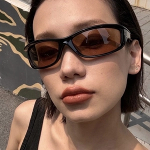 Y2K futuristic cycling sunglasses with black frames and tinted lenses for women