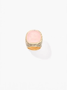 Top view of gold textured ring featuring a large oval pink crystal gemstone