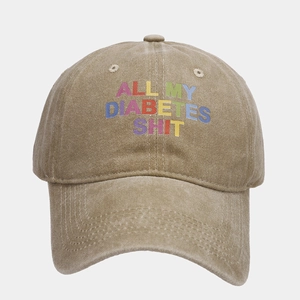 Detailed close-up of distressed cotton baseball cap with colorful letter print slogan