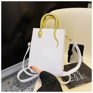 Detail of white crocodile pattern PU tote bag featuring a creative gold snake handle