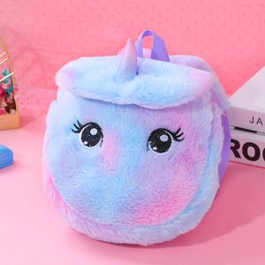 Cute plush unicorn backpack in gradient pink and blue for girls on a dreamy pink background