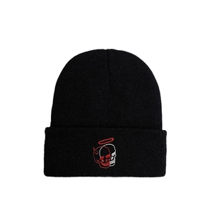 Black knit beanie with unique dual-tone skull embroidery and warm winter texture