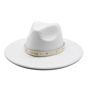 Detail of white wool fedora hat with beige leather band and golden stud rivets