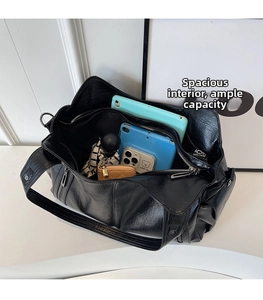 Detailed view of the large capacity tote bag interior with multiple zip compartments