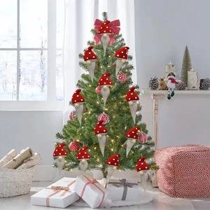 Christmas gnome ornaments with red polka dot hats hanging on a festive holiday tree