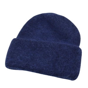 Close-up of deep blue winter knit beanie showing the soft mohair wool texture and thick cuff