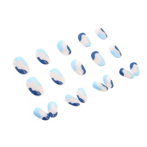 Blue sea salt wave press-on nails in oval shape with a high-gloss polished finish