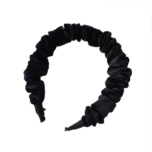Classic black velvet headband with pleated texture design on a clean white background