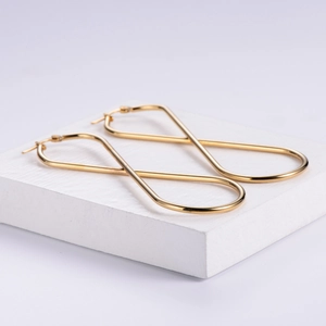 Minimalist gold plated stainless steel infinity hoop earrings with twisted design