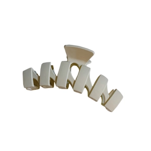 Minimalist large cream hair claw clip with vintage geometric matte finish design