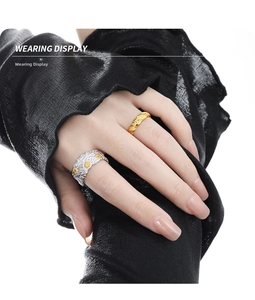 Wearing display of vintage silver daisy ring and minimalist gold twist rope ring set