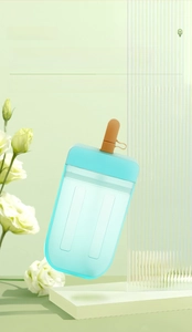 Detail of popsicle shaped water bottle with straw and mint green matte finish