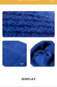 Detail of the navy blue ribbed knit texture and the double fold hem on the warm beanie