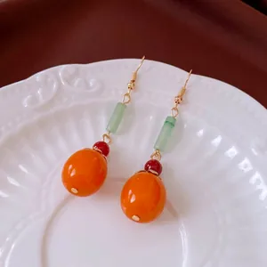 Traditional Chinese persimmon dangle earrings with orange beads and gold-tone ear hooks
