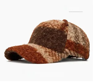 Detail of brick red checkerboard pattern on plush faux lamb wool baseball cap