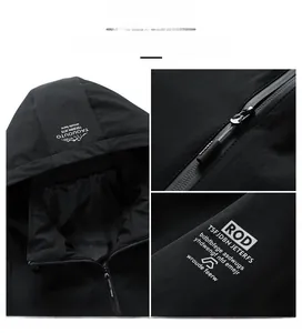 Detail of black hooded jacket featuring waterproof zipper and tech fabric texture