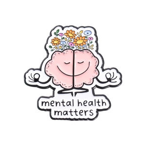 Pink brain enamel pin with colorful flowers and Mental Health Matters text for awareness