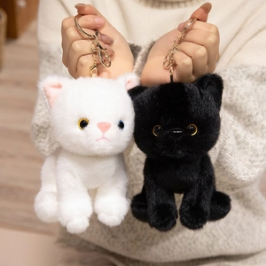 Cute realistic plush cat keychains in black and white with golden metal ring and lobster clasp