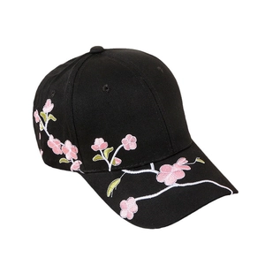 Classic black baseball cap with detailed pink plum blossom embroidery on high-density fabric