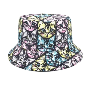Detailed view of the vibrant all-over cartoon cat print on a double-sided bucket hat