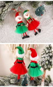 Close-up of red and green Christmas elf ornaments with bells on mesh fabric