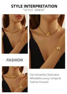 Detailansicht der breiten Mesh-Gliederkette in Gold mit Herz- und Sternanhängern