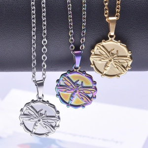 Three minimalist stainless steel dragonfly pendant necklaces in gold, silver, and iridescent