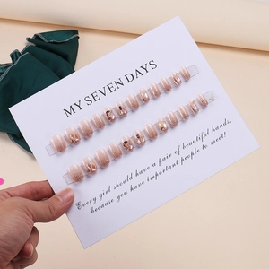 Handmade nude pink gradient press-on nails with glitter and rhinestones, 24-piece set