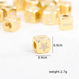 Macro shot of 18K gold plated zircon cube bead showing 0.9cm size and 2.7g weight