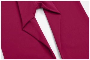 Detail of gusseted crotch and flatlock stitching on dark berry yoga leggings