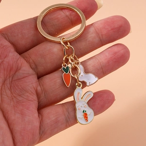 Cute bunny keychain with carrot enamel charms on a gold ring for fashionable accessories