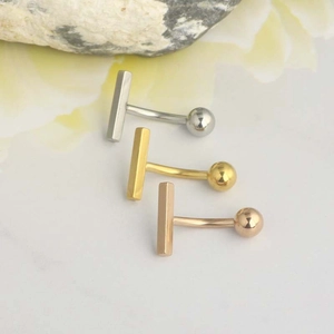 Polished metal belly button rings in silver, gold, and rose gold with ball ends