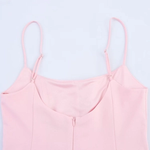 Detail of pink striped mini dress featuring adjustable straps and a hidden back zipper