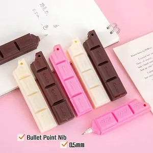 Chocolate bar shaped creative ballpoint pens in brown pink and white on a desk