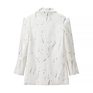 Women's white V-neck blazer with black artistic graffiti ink splatters and padded shoulders