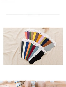 Detailed flat lay of nylon velvet mid-calf socks in 15 vibrant assorted colors