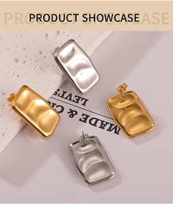 Detail of rectangular wave-textured stud earrings in gold and silver finish